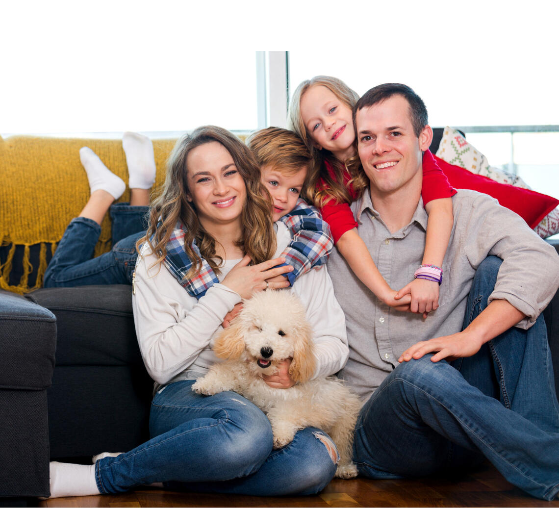 a happy family with their dog